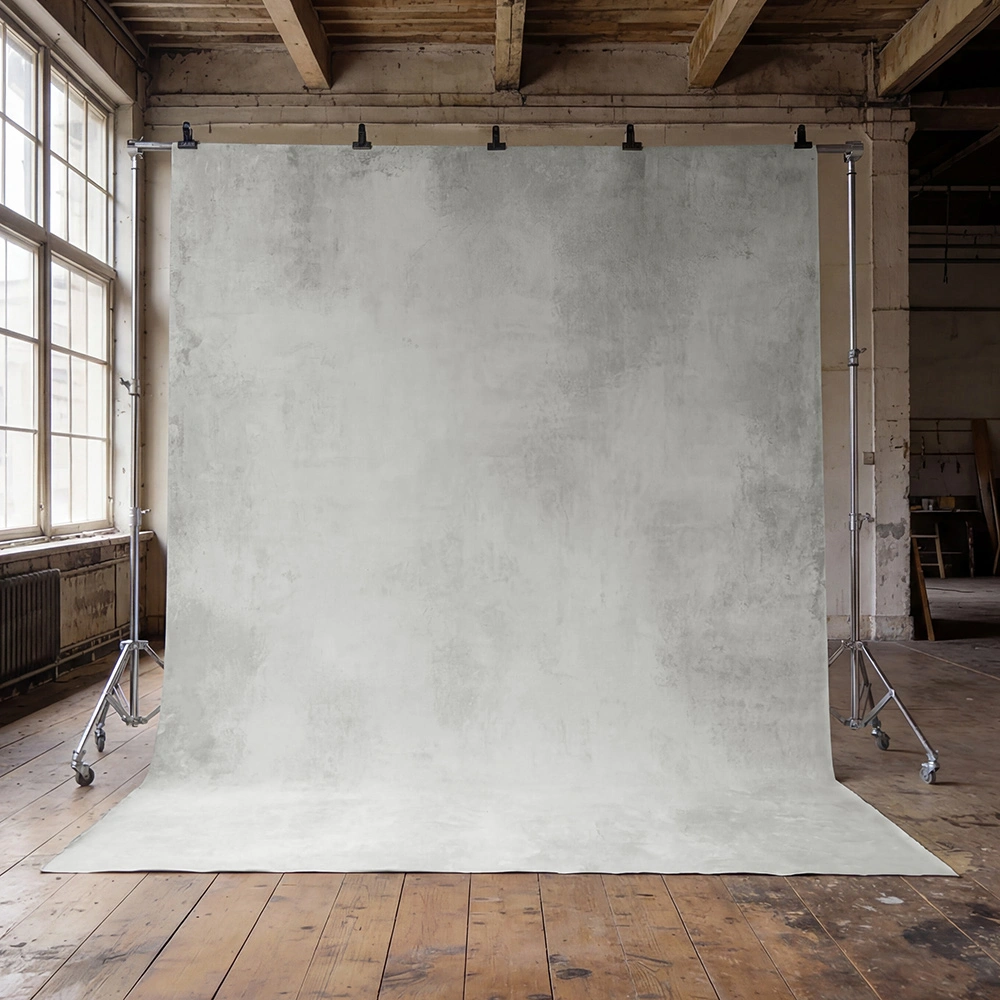 fine-art-photo-studio-backdrops Light grey hand-painted canvas backdrop with a richly textured, industrial finish. Ideal for dramatic studio portraits, fashion editorials, and creative photography.