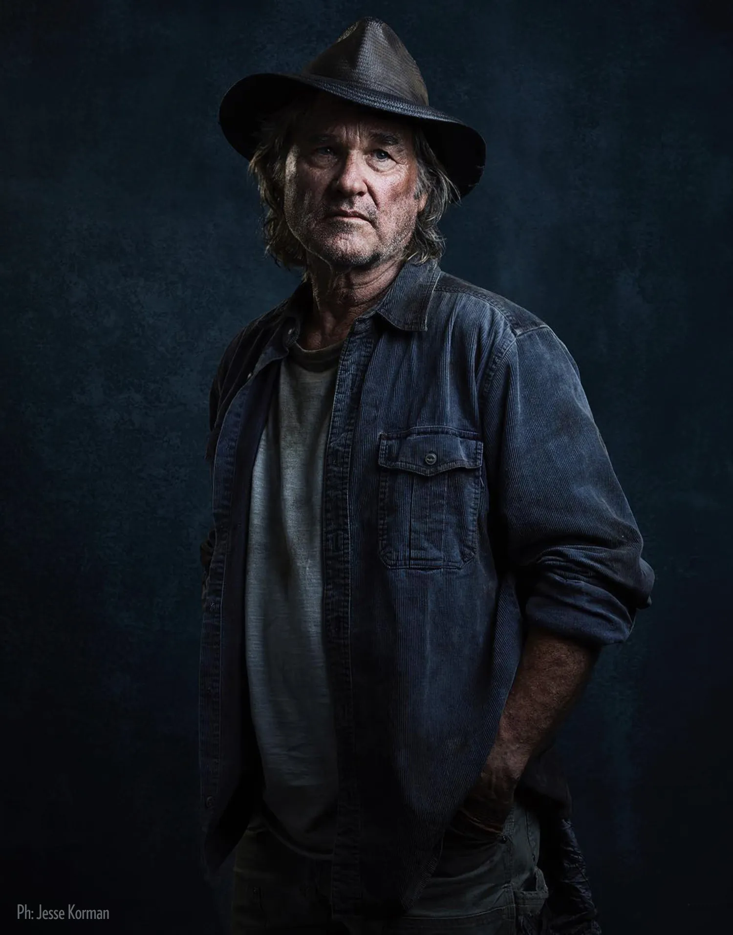 unique-canvas-hand-painted-backdrops Dark blue textured backdrop for studio portraiture. Portrait of Kurt Russell by Jesse Korman